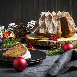 Christmas Chestnut And Chocolate Cake On A Tree Bark Disc by Christian Kutschka