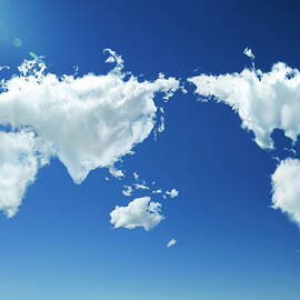 Clouds Forming Heart World Map In Sky by Yuji Sakai
