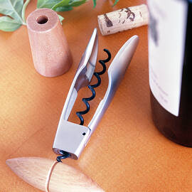 Corkscrew With Wooden Handle On Table by Jalag / Jan C. Brettschneider