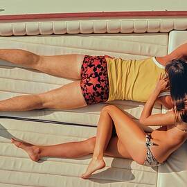 Couple Lying Face Down On A Boat by Douglas Mesney