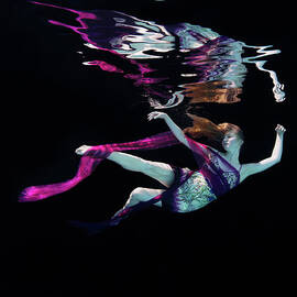Female Dancer Floating Underwater by Thomas Barwick