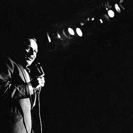 Frank Sinatra on stage at the Sands Hotel and Casino where he is performing with Count Basie and the the Count Basie Band. by John Dominis
