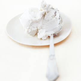 Fresh Goat Cheese On White Plate And Spoon by Jalag / Janne Peters