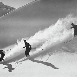 Group Of Skiers Descending Alpine by H. Armstrong Roberts