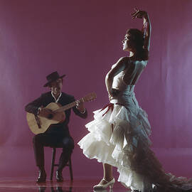 Guitarist Playing Guitar And Woman by Tom Kelley Archive