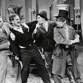 HARPO MARX , THE MARX BROTHERS , CHICO MARX and GROUCHO MARX in THE COCOANUTS -1929-. by Album