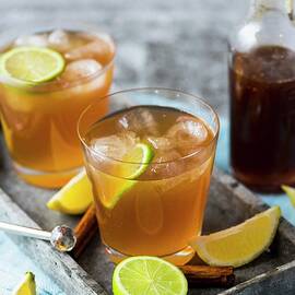 Homemade Cola With Ice Cubes And Lime Slices by Hein Van Tonder