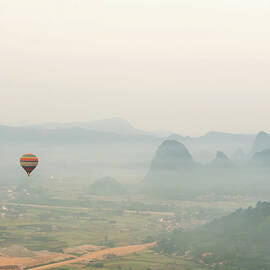 Hot Air Balloon Ride At Dawn Over Karst by Alex Linghorn