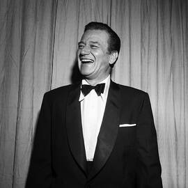 John Wayne At The Oscars by Michael Ochs Archives