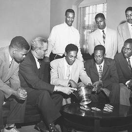 Lee Calhoun With Teammates And Evening by North Carolina Central University