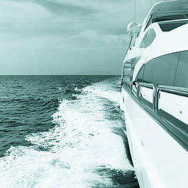 Luxury Yacht Sailing At Sea. Blue Toned by Petreplesea