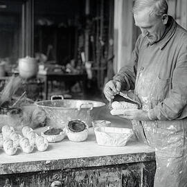 Man Casting Duplicates Of Dinosaur Eggs by Bettmann
