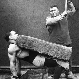 Man Crushing With A Hammer A Rock Block by Keystone-france
