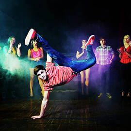 Man Dancing In Front Of A Crowd Of by Flashpop