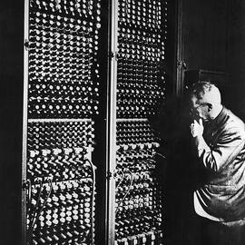 Man Next To Huge Eniac Computer Wcords by Bettmann