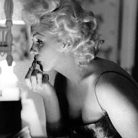 Marilyn Getting Ready To Go Out by Michael Ochs Archives