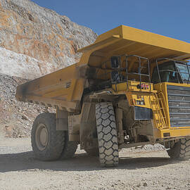 Mining Tractor Working In Open Pit by Cavan Images