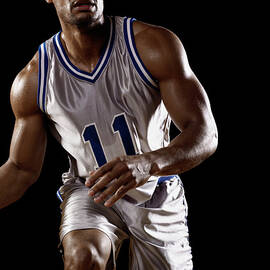Mixed Race Basketball Player Bouncing by Patrik Giardino