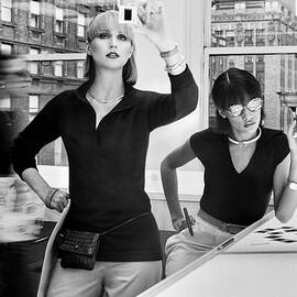 Models Viewing Photographic Slides by Duane Michals