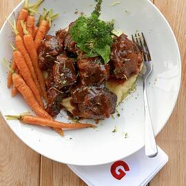 Oxtail Ragout On Mashed Potatoes And Parsnips With Carrots by Robbert Koene