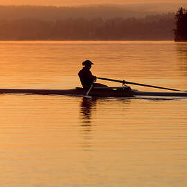 Person Rowing Sculling Boat On River by Pete Saloutos