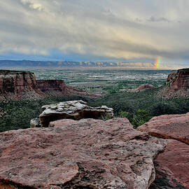 Rainbow over Book Cliffs from Grand View Point by Ray Mathis