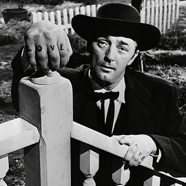 ROBERT MITCHUM in THE NIGHT OF THE HUNTER -1955-. by Album