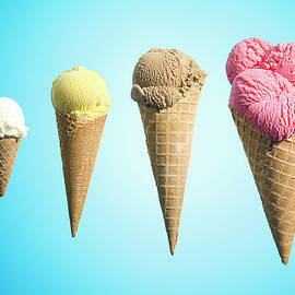 Row Of Different Flavor Ice Creams In by Jonathan Knowles