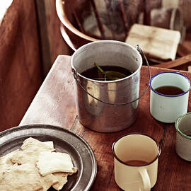 Rustic Table With Billycan Tea And Biscuits by Brett Stevens