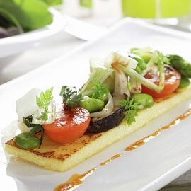 Sauted Vegetables On Polenta With Romesco Vinaigrette by Gastromedia