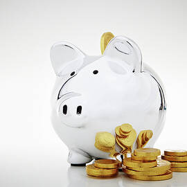 Stack Of Gold Coins By Piggy Bank by Ethan Elliot