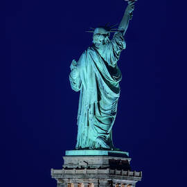 Supermoon Statue Of Liberty by Susan Candelario