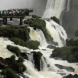 Tourists View the Iguazu Waterfalls by Jorge Adorno