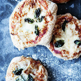 Tray Of Pizzas With Herbs by Line Klein