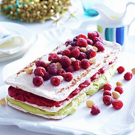 Tray Of Raspberry Macadamia Vacherin Layer Cake On Decorated Table by Brett Stevens