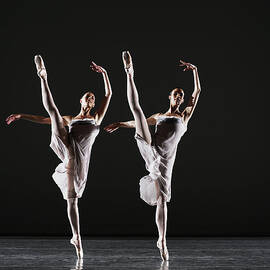 Two Ballerinas Dancing On Stage, Legs by Thomas Barwick