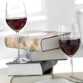Two Glass Of Red Wine With Stack Of Books by Jalag / Michael Bernhardi
