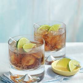 Vodka-cola With Limes And Ice Cubes by Jonathan Gregson