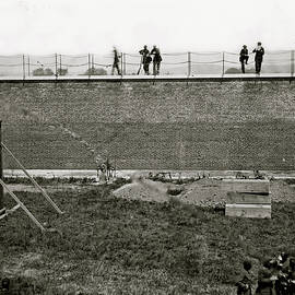 Washington, D.C. Coffins and open graves ready for the conspirators' bodies at right of scaffold by 