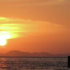 Watching A Sunset From The Jetty by Thepurpledoor