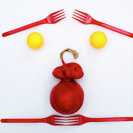 Handmade smoked hard cheese in paraffin shells with balls and red forks by Valentin Ivantsov