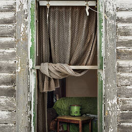 A Glimpse Back -  view through broken window of abandoned ND farmstead by Peter Herman