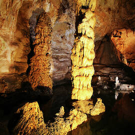 A Stalagmite and Column in Carlsbad Caverns National Park, NM, USA by Derrick Neill