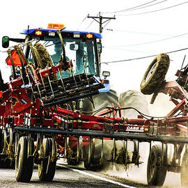 Agricultural combine harvester on the road, Ontario, Canada by Tatiana Travelways