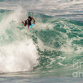 Airborne Bodyboarder Takes on Banzai Pipeline Winter Waves on he North Shore of Oahu in Hawaii by Phillip Espinasse
