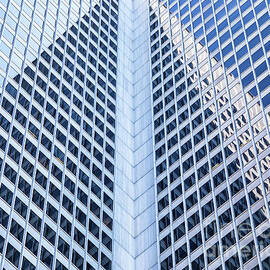 Architectural abstract of a modern building with numerous windows and reflections by Jane Rix