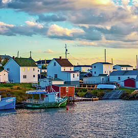 Arriving to Fogo Island by water, at dusk by Tatiana Travelways