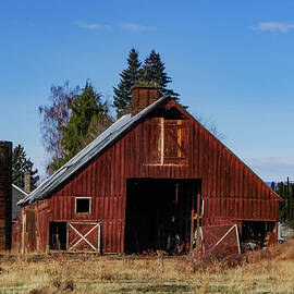 Barn and wooden silo by Jeff Swan