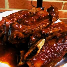 BBQ sauce on ribs by Thomas Brewster
