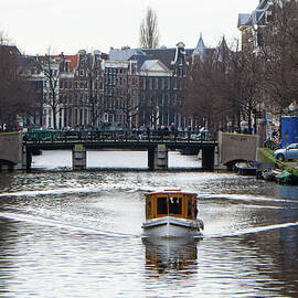 Boating on a gracht at Amsterdam by Juergen Hess